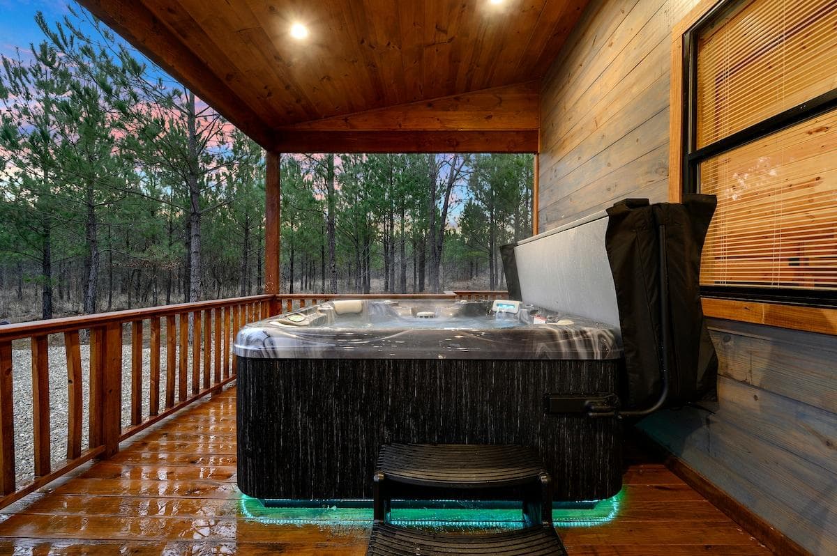 Immerse yourself in tranquility in our lavish hot tub, equipped with cozy seating for up to seven guests and a picturesque view of the beautiful outdoors.