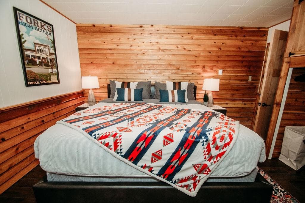 One of three king bedrooms, each featuring a luxurious 12" memory foam mattress and its own electric floor heater, ensuring a perfect night's rest even on cooler nights.